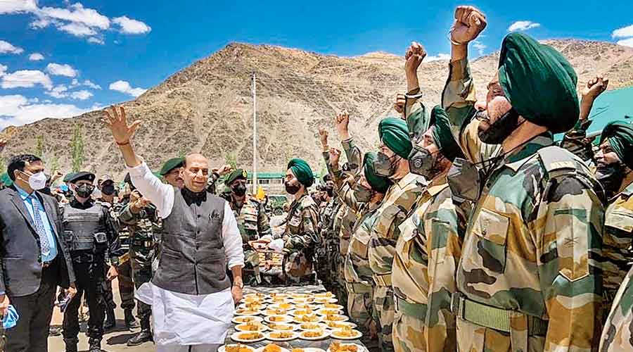  Defence minister Rajnath Singh interacts with soldiers during his visit to Karu, Ladakh, on Monday