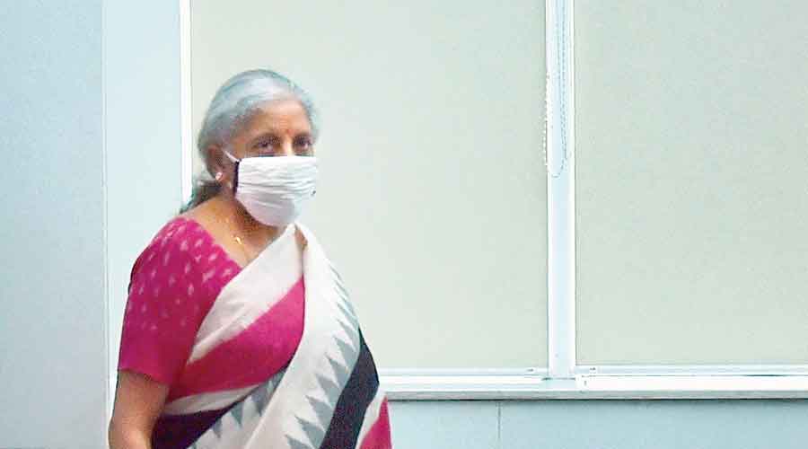 Nirmala Sitharaman arrives to address the news conference in New Delhi on Monday