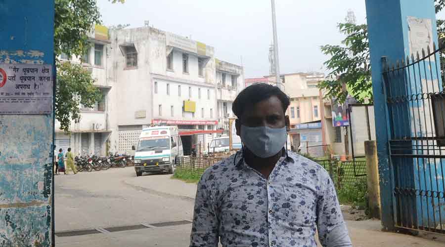 Staff member Suru Patro at the entrance of the MGM Medical College Hospital on Wednesday. 