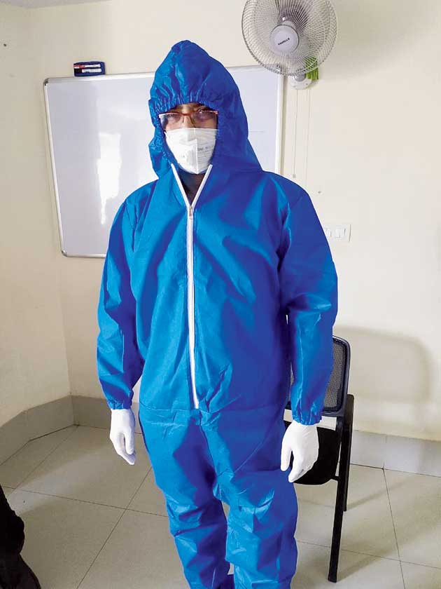 Pratik Dasgupta ready in personal protective equipment to see patients