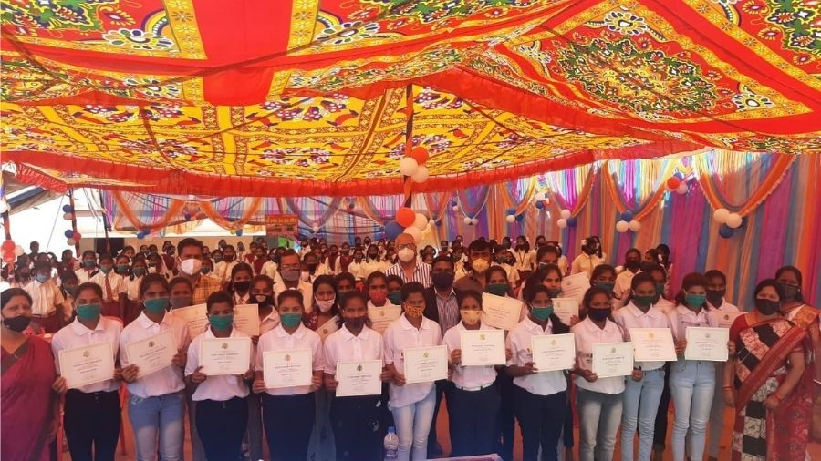 Girls who successfully completed he US Consulate's English programme pose with their certificates in Khunti on Saturday.