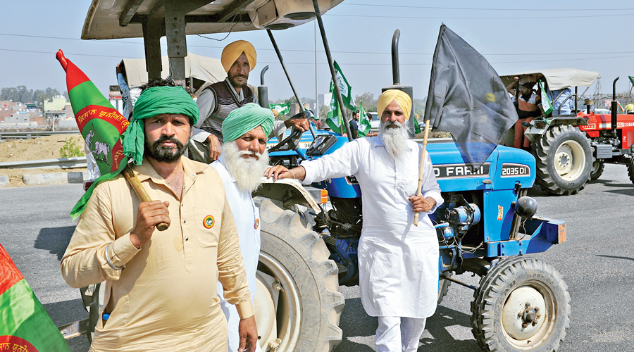 Farmers protest on their tractors.