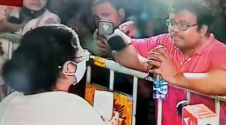 Mamata speaks to a person who was waiting outside the  fire-hit Strand Road building