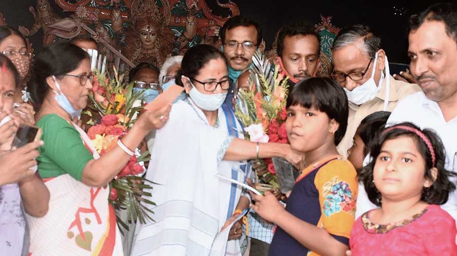 The chief minister interacts with people at a Durga temple in Nandigram 2 block