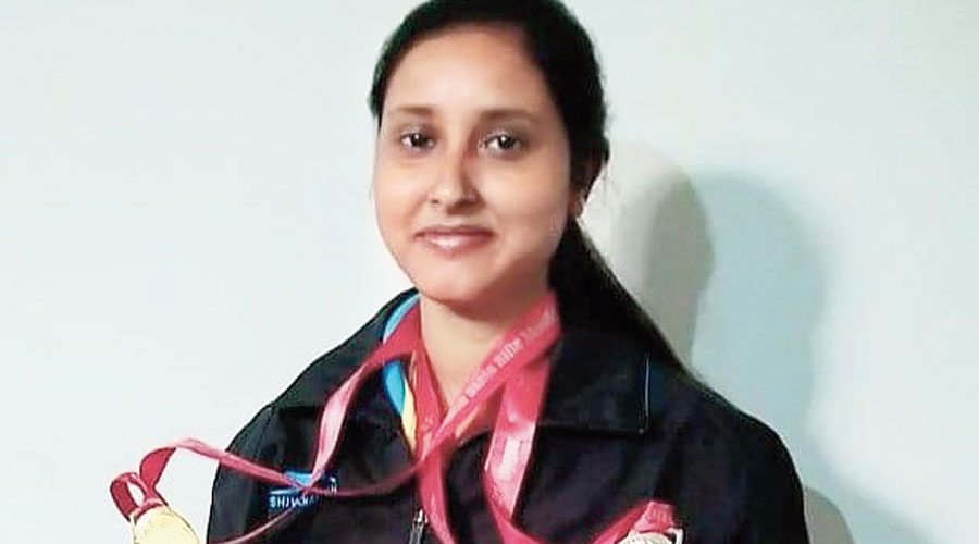 Konica Layak with her medals in Dhanbad. 