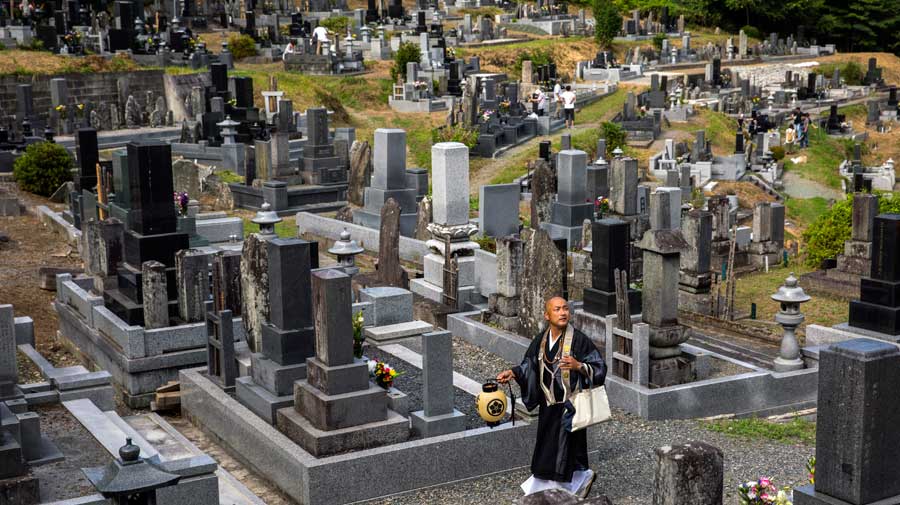 Nobuo Kobayashi, a Buddhist monk, visits the graveyard associated with Kongoji Temple in Kesen, Japan, on Aug. 13, 2019, more than eight years after the earthqauke and tsunami that nearly destroyed the village in 2011. 