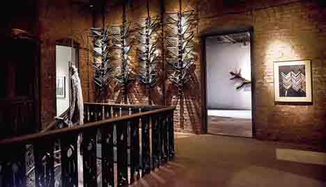 The stunning installation depicts a erect spine made of engine parts, one that will help you soar, like a butterfly. The wings made of Ambassador side windows.