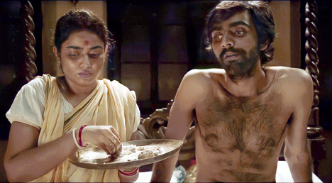 Kinjal (right) as Hiralal in the final moments of the film. Stricken by cancer, Hiralal passed away in 1917.