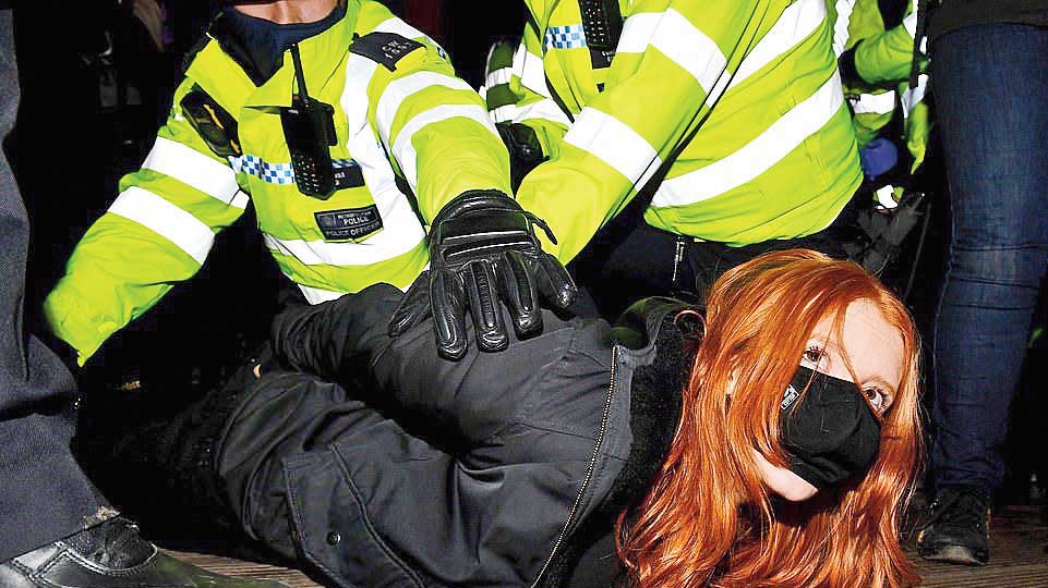 Patsy Stevenson being pinned down by police in Clapham
