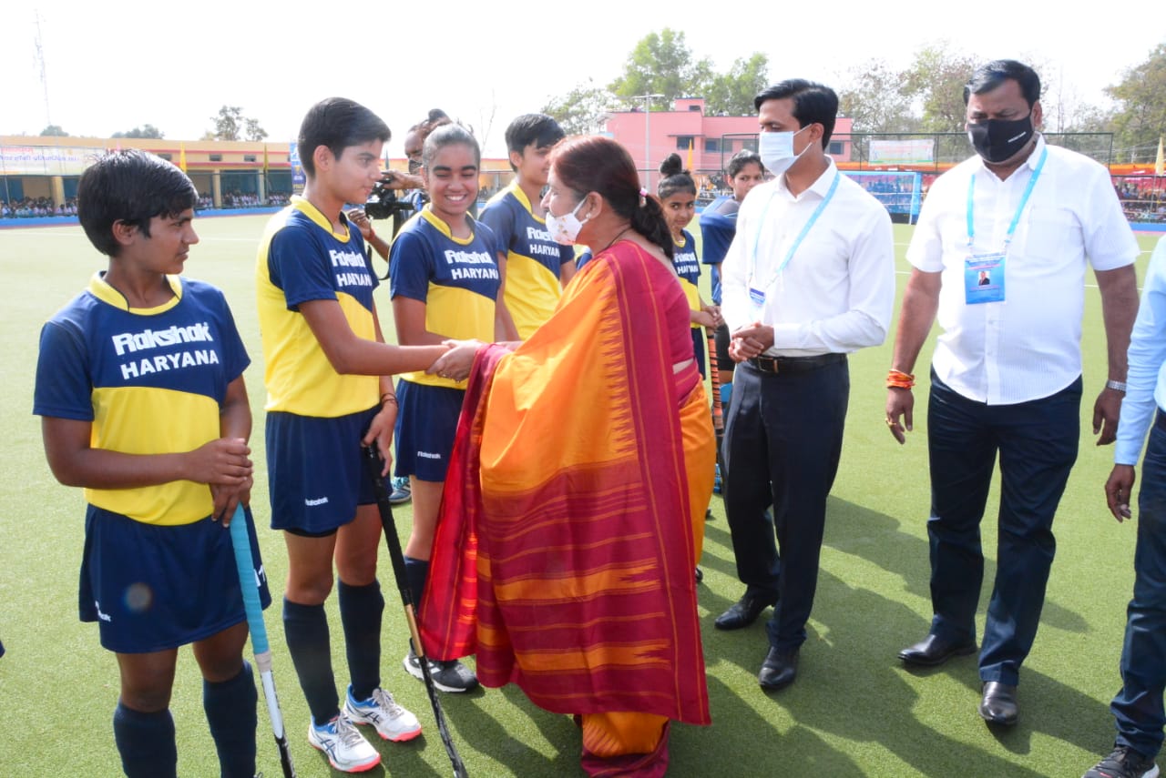 Ranchi University acting VC Kamini Kumar congratulates Haryana team members after the match. in Simdega on Thursday.