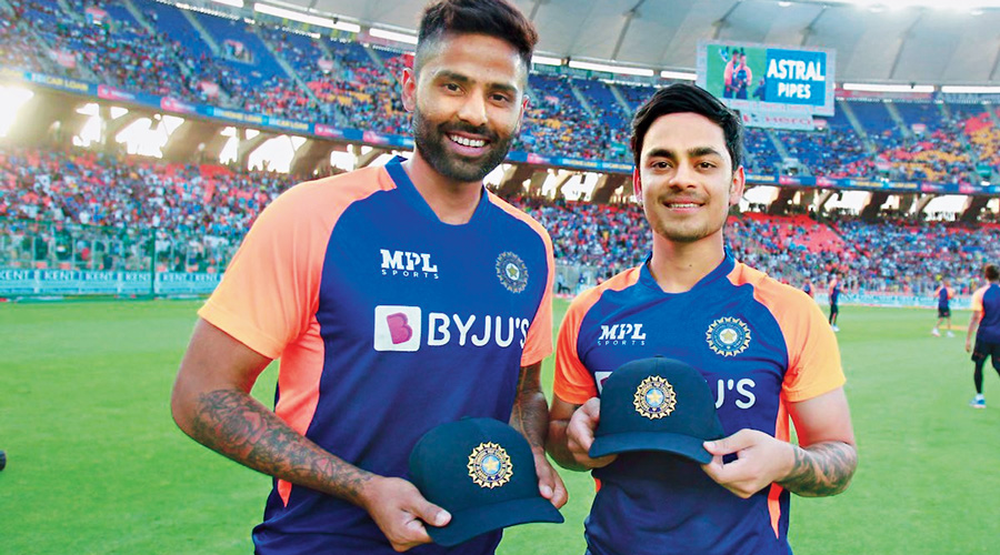 Suryakumar Yadav and (right) Ishan Kishan after  receiving their India caps ahead of the second T20I against England in Ahmedabad.