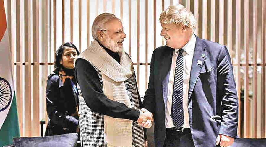 Prime Minister Narendra Modi (L) with his UK counterpart Boris Johnson during an earlier meeting