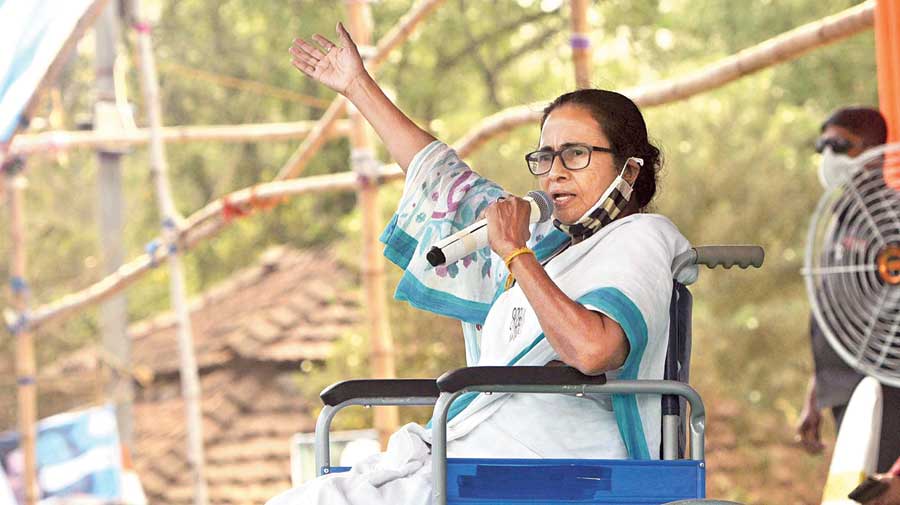 Chief minister Mamata Banerjee waves to her supporters in an East Midnapore rally on Saturday