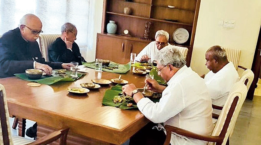 Odisha chief minister Naveen Patnaik having lunch with (clockwise from right) H.D. Deve Gowda, Sitaram Yechury,  L.K. Advani and Pranab Mukherjee at Naveen Niwas in 2018.