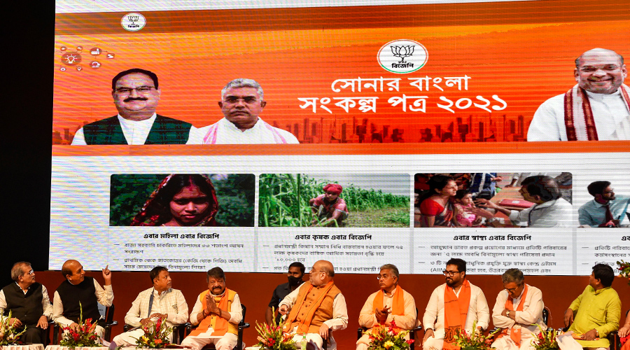 Union Home Minister Amit Shah along with others after releasing the BJP manifesto ahead of West Bengal Assembly Elections in Calcutta on Sunday.