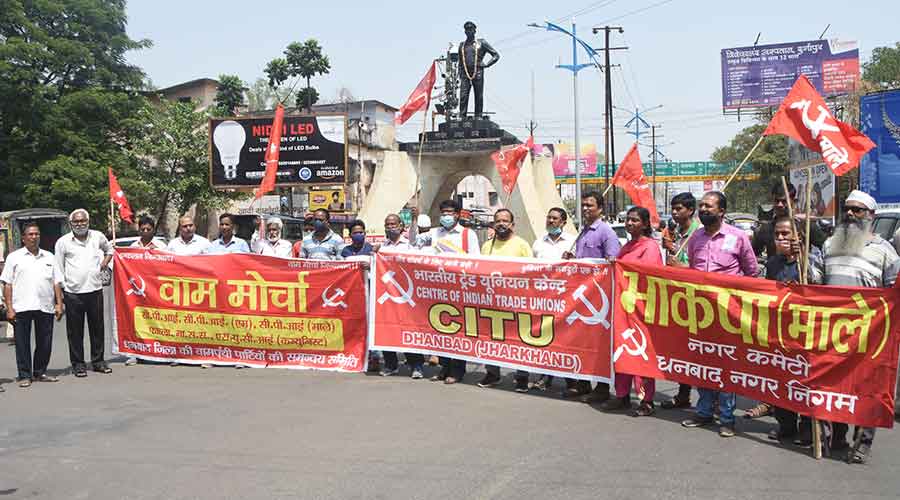 Activists of different left parties under the banner of Joint Left Front demonstrate and block the Randhir Verma Chowk in Dhanbad during the Bharat Bandh on Friday..