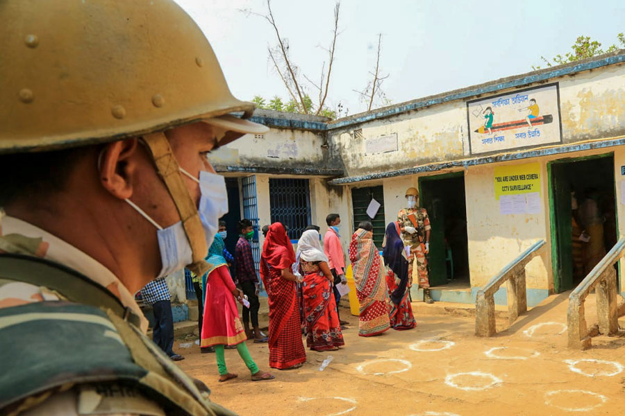Security persons keep a tight vigil during the 1st phase of Assembly Election in the sensitive naxal infested Ooro village under Jhargram district on Saturday