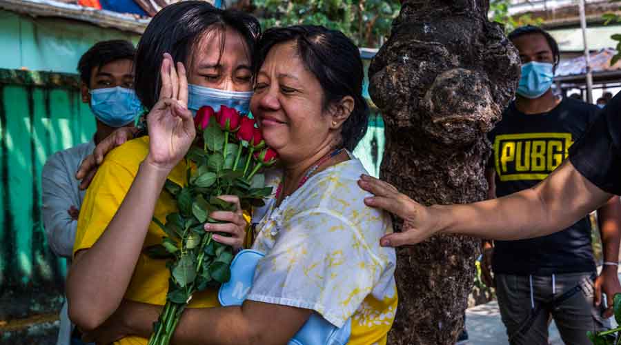 A protester released from prison after three weeks of detention is reunited with her mother in Yangon, Myanmar