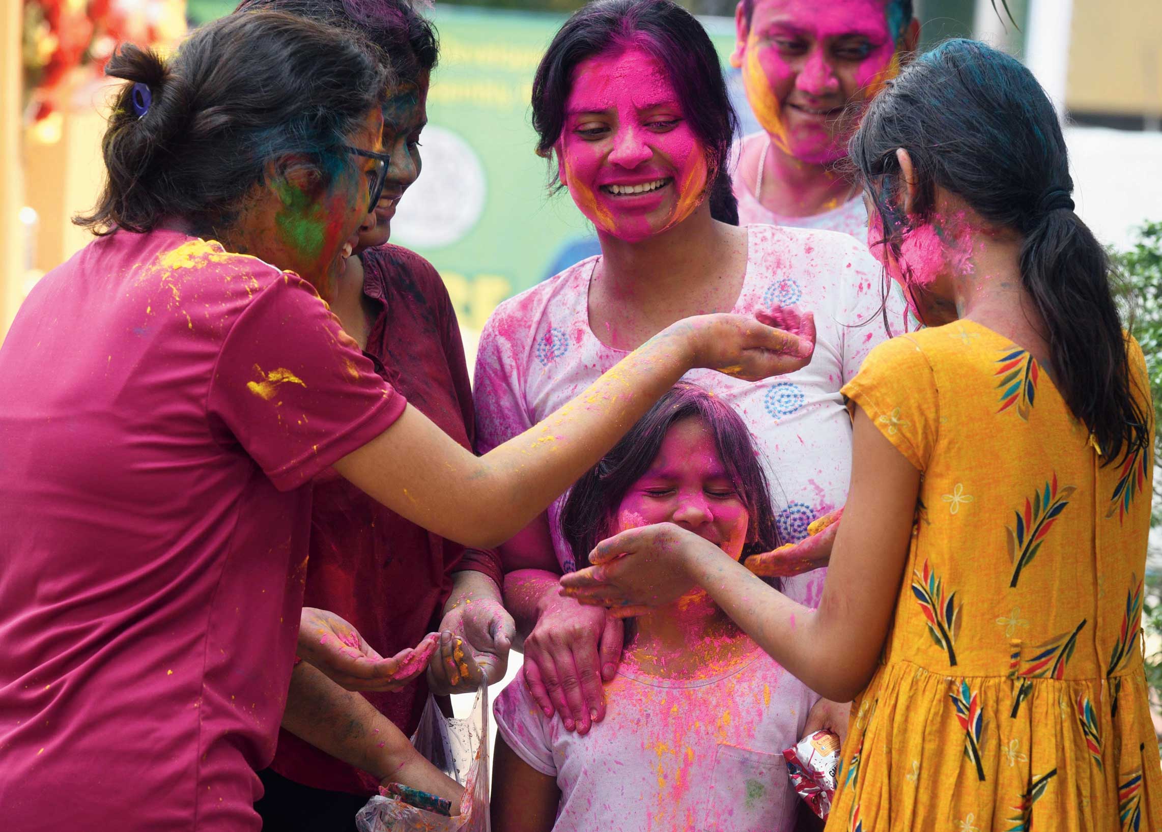 Children play with colours at Sreebhumi in Lake Town