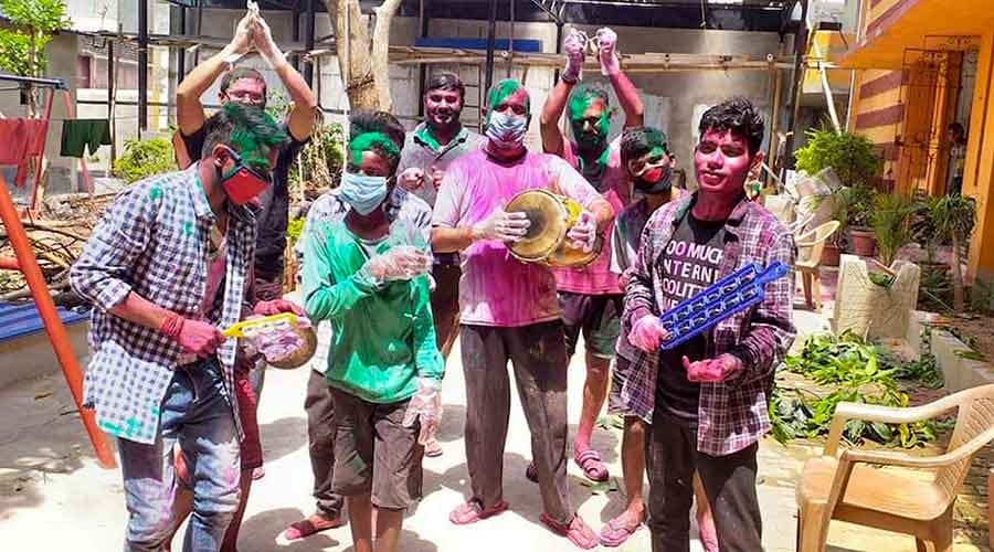Children seen playing Holi with their friends in different apartments and flat complexes across the city