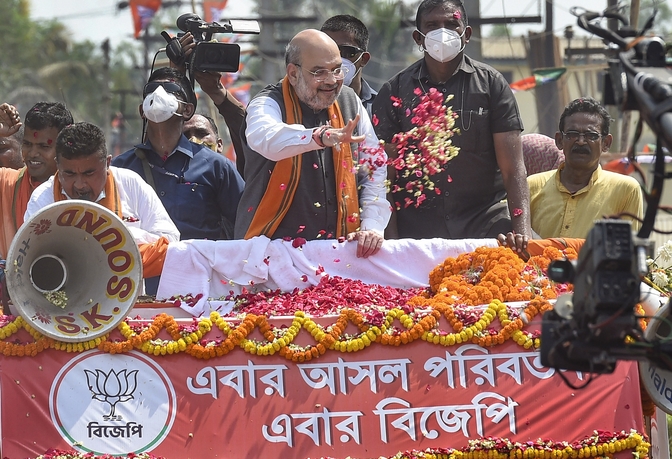 Union home minister Amit Shah greeted with flowers as he campaigns for BJP candidate Suvendu Adhikari at Nandigram on Tuesday.
