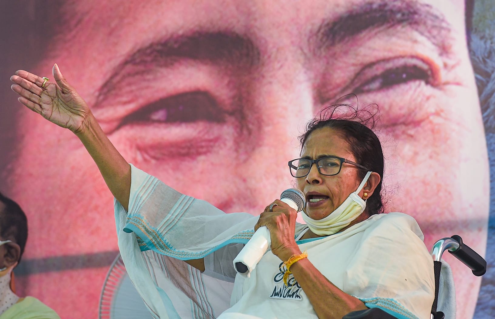 Mamata Banerjee addresses a gathering during her rally on Tuesday.