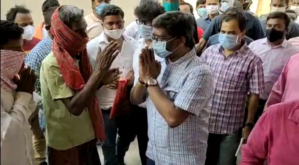 The chief minister greets a local as he visits the villagers' homes in Nemra.