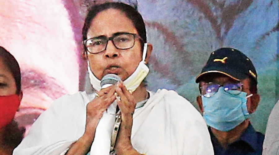 Mamata Banerjee on her feet while singing the national anthem at Tengua in Nandigram on Tuesday.
