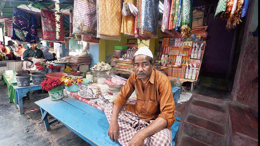 Salim Dewan, 65, who owns a store selling incense sticks, flowers, chadars and other objects offered to the Pir’s resting place