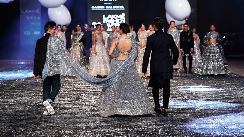 Manish Malhotra picked up Kiara’s long train, adding to the fun mood of the show