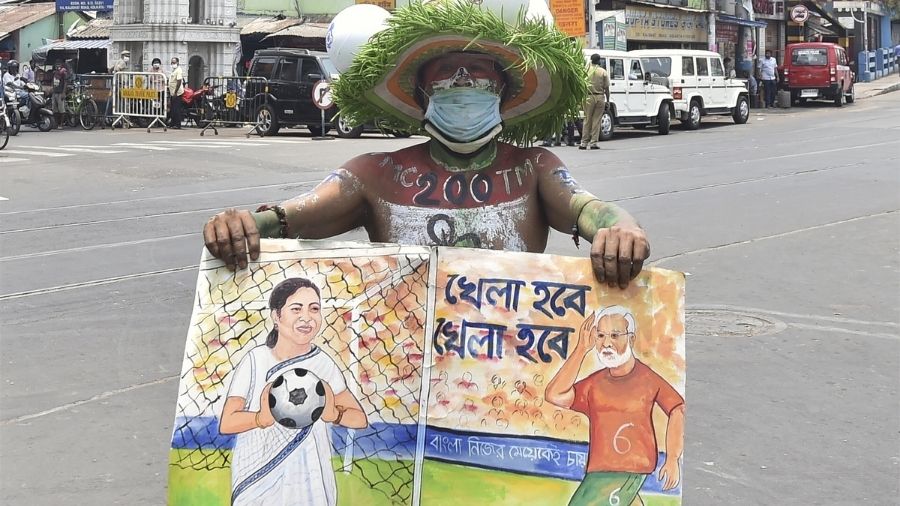 A supporter celebrates TMC's win on Sunday in Calcutta.