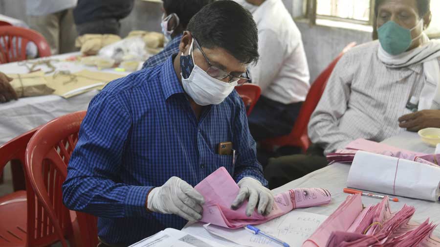 Polling officer counting panchayat election ballots at Polytechnic counting centre in Lucknow on Sunday.