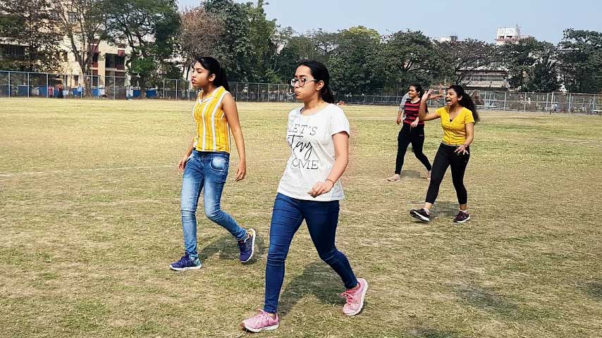 Girls take part in the lemon-and-spoon race at CK-CL Park