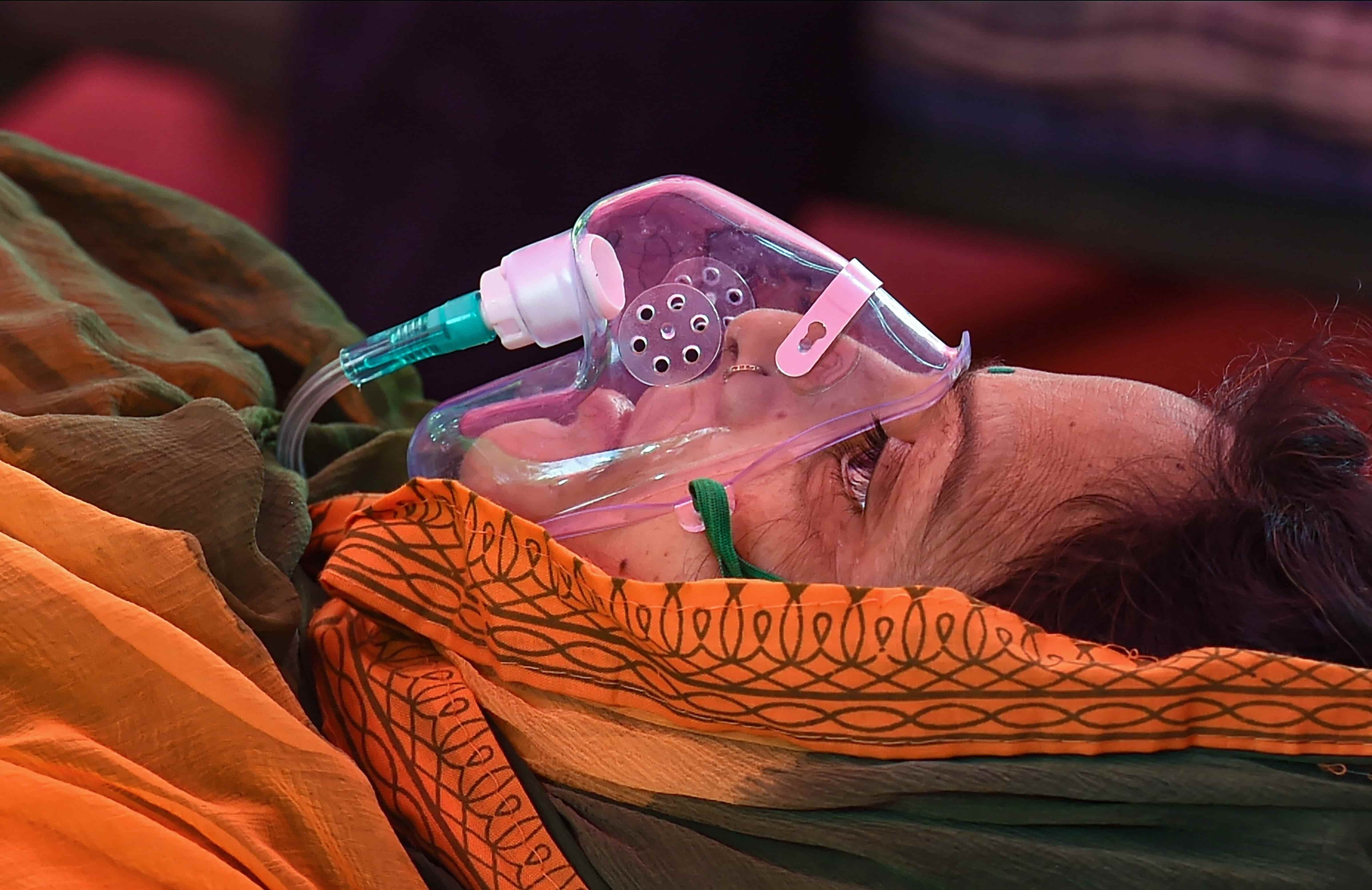 The oxygen crisis in the country has shown the humanitarian side of the citizens with several NGOs and other groups come forward to save those in need. In this photo, a Covid-19 patient receives free oxygen from a Sikh organisation in Ghaziabad, on May 8.