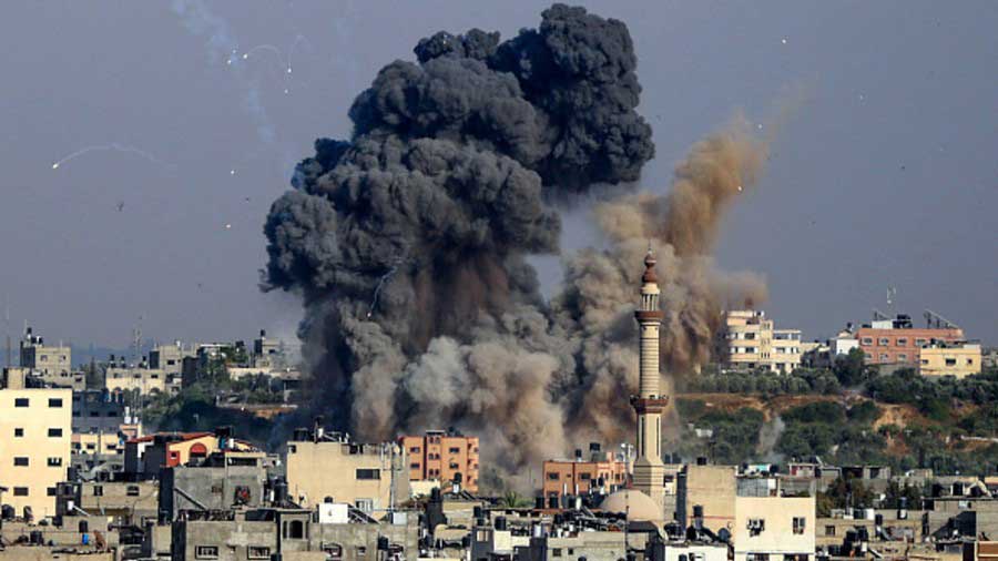 Smoke billows from Israeli air strikes in Gaza City, controlled by the Palestinian Hamas movement, on May 11, 2021. 