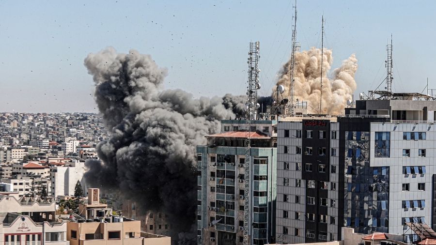 An Israeli airstrike destroys a high-rise building in Gaza City, Gaza Strip, that housed media outlets including The Associated Press and Al Jazeera, on Saturday.