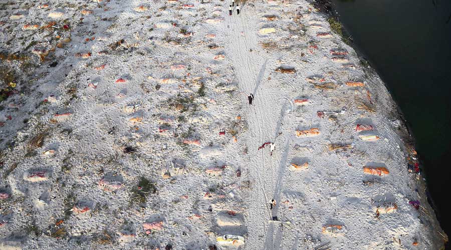 Bodies buried in the sand near the banks of the Ganga in Allahabad, as seen on Saturday during the second wave of Covid-19. 