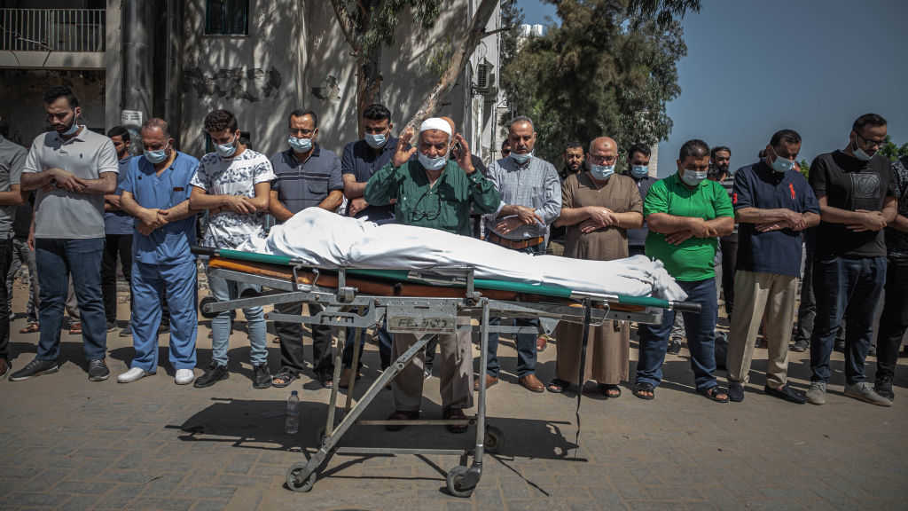 Palestinians perform funeral prayers for a member of the al-Kulak family, who was killed during an Israeli raid on Gaza City on May 16, 2021 in Gaza City, Gaza.