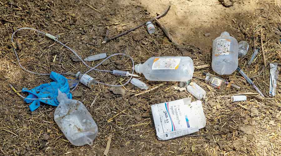 Infusion bags and other medication that were used to treat villagers with breathing difficulties are seen at the makeshift open-air clinic