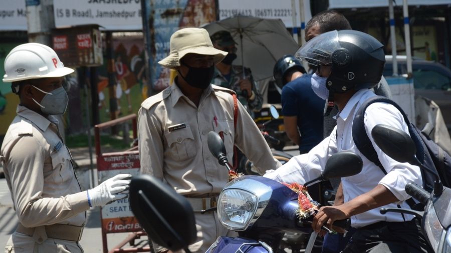 Police stop commuters to check for e-passes at Sakchi in Jamshedpur on Tuesday.