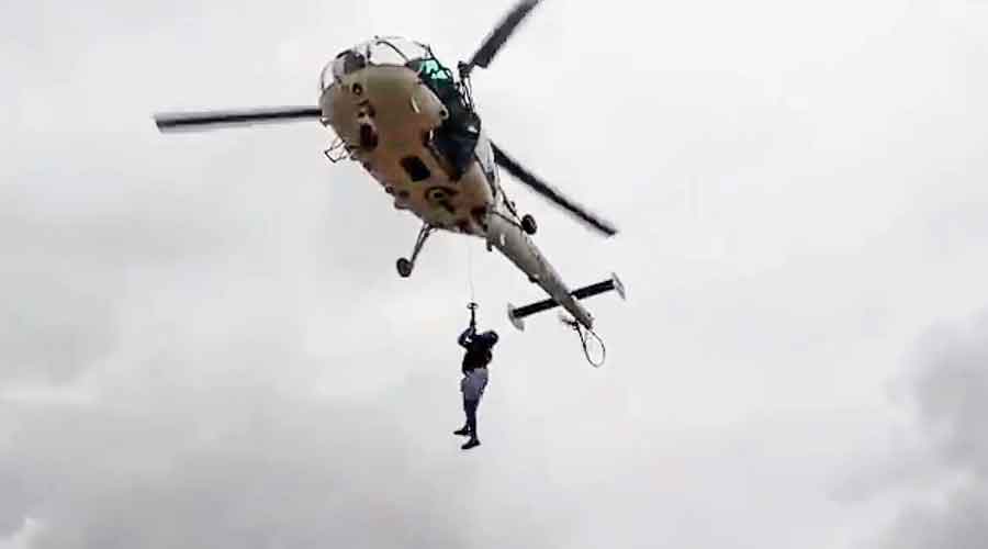 A Chetak helicopter rescues employees of the Directorate General of Lighthouses and Lightships stranded at the Vengurla Rock lighthouse  in Maharashtra.