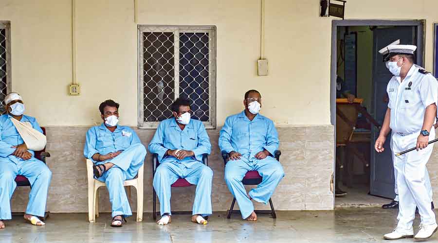 Rescued crew members of barge P305 after they were brought to the INS Shikra in Mumbai on Tuesday