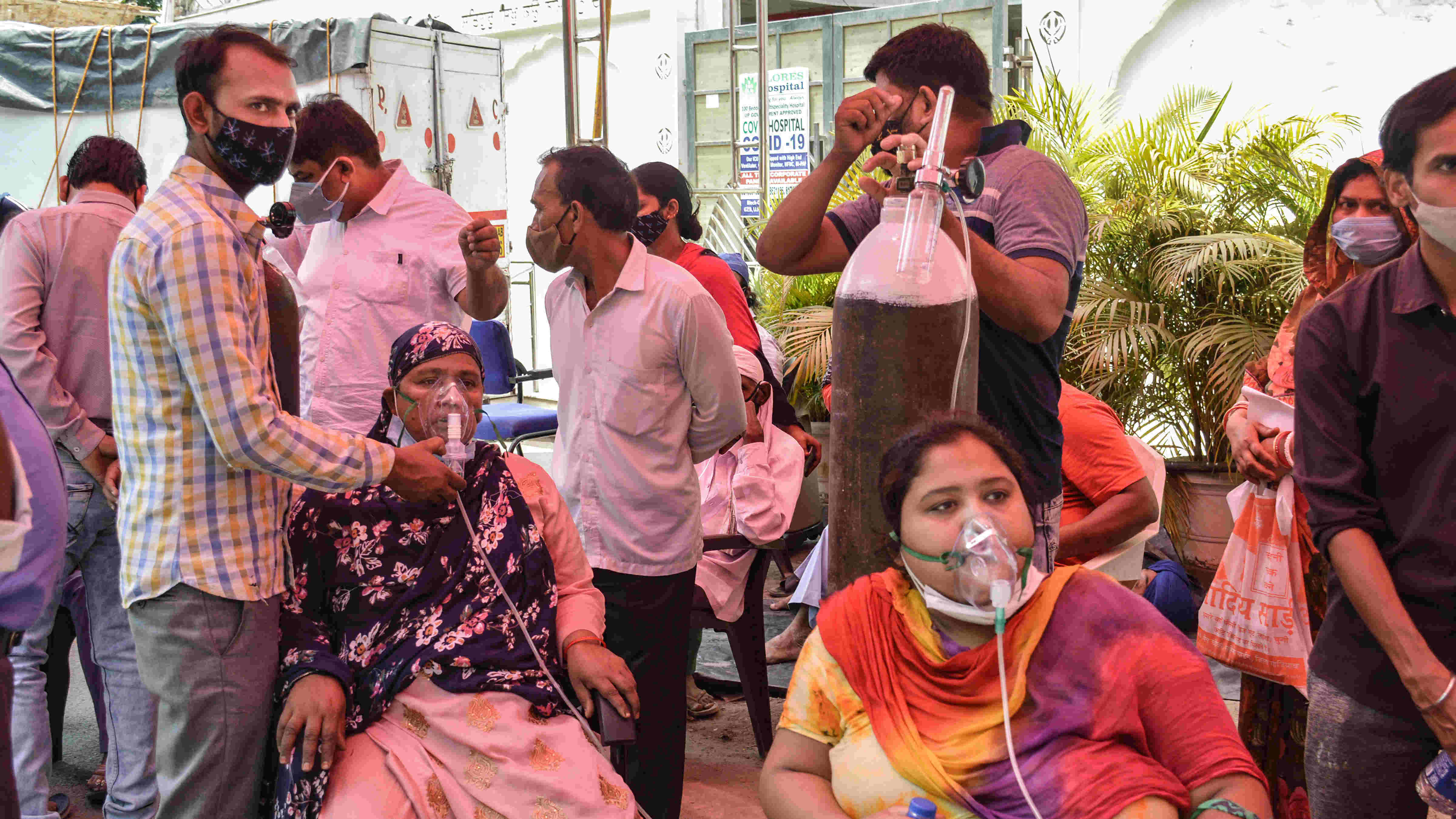 Covid-19 patients receive free oxygen, provided by a Sikh organization at Indirapuram Gurudwara, in Ghaziabad, Monday, April 26, 2021.