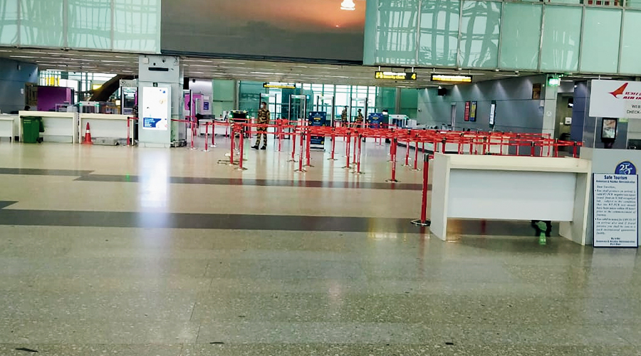 Calcutta airport wears a deserted look on Wednesday morning. Fights were suspended from 8am to 7.45pm as a precaution against Cyclone Yaas.