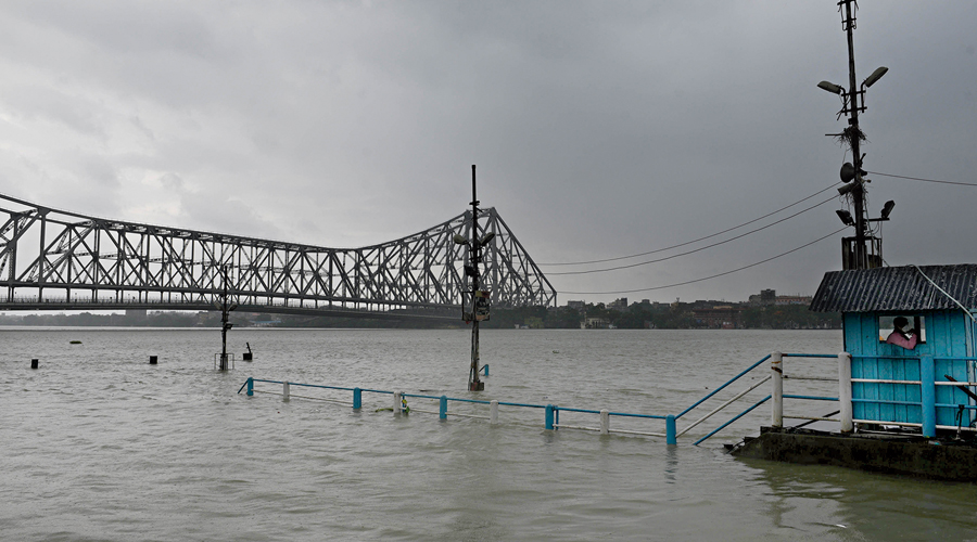 Water flows over the stairs of the Howrah Launch Ghat during  high tide on Wednesday.