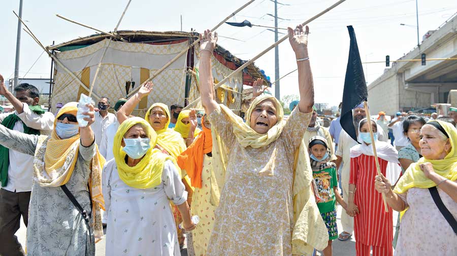 Farmers protest against the three farm laws on Wednesday, which was observed  as Black Day to mark the completion of six months of the sit-in at Delhi’s  borders, at Ghazipur. 