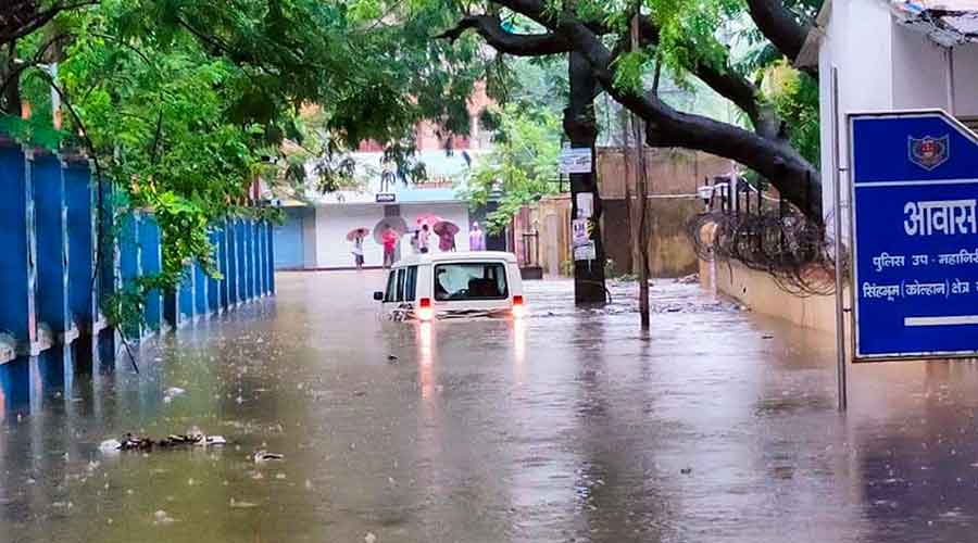 A vehicle under water at DIG residence in Chaibasa, West Singhbhum. 