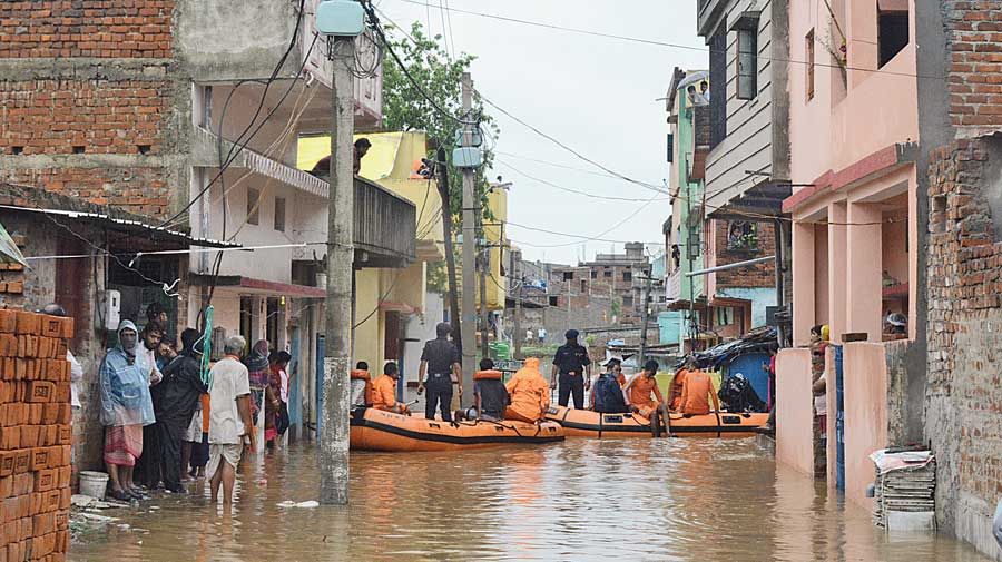 NDRF personnel carry out rescue operations at the inundated Bagbera area on Thursday. 