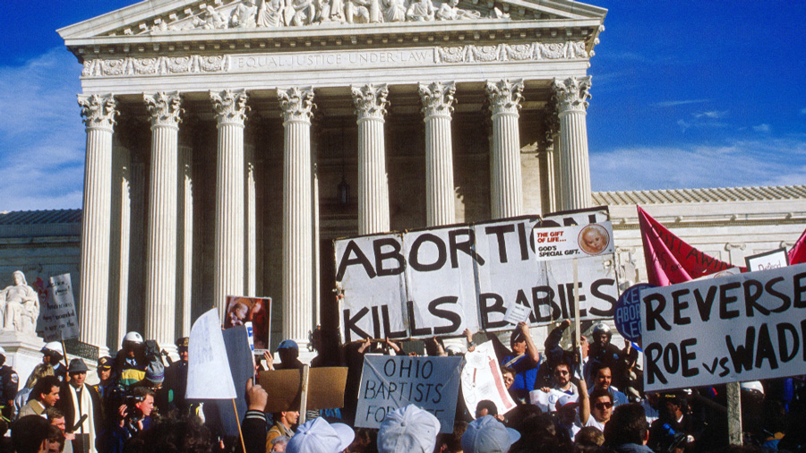 People participate in the Annual Right to Life March as it passes in front of the United States Supreme Court. 