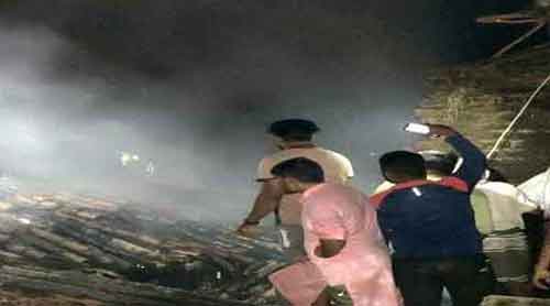 Local residents gather at the spot in Koderma on Saturday night.